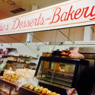 a bakery with a sign above the counter