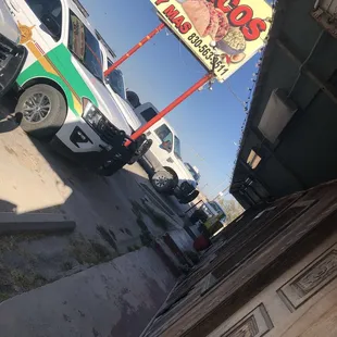 a truck parked in front of a restaurant
