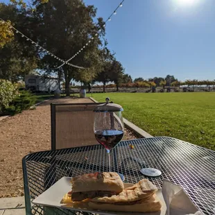 a glass of wine and a plate of food