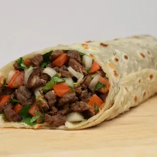 a burrito with meat and vegetables