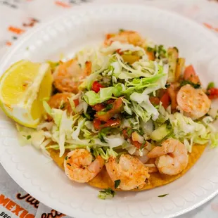 a plate of shrimp tacos