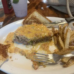Stuffed pepper steak with queso and home fries- ( forgot to snap before I ate ) but it is a consistent go to!