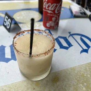 a drink in a glass with a straw