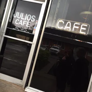 the reflection of a man in the window