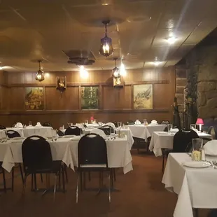 a dining room with tables and chairs