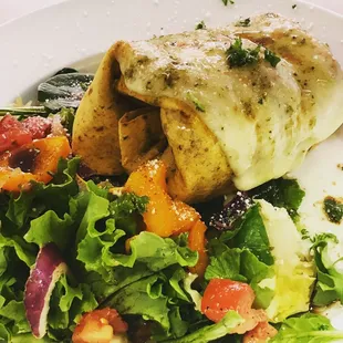 Lunch special of filet mignon wrap served with side salad