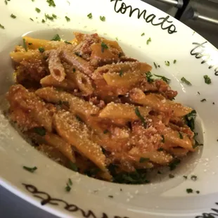 Bolognese served over penne pasta