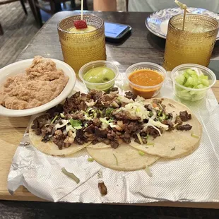 Tacos Camineros with Steak and Cucumber Mezcal cocktails