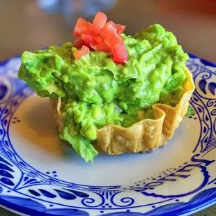 a guacamole in a tortilla shell