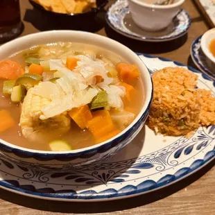 a bowl of soup and a plate of rice