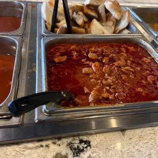a variety of food items in a buffet