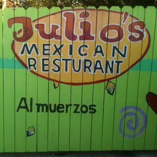 a sign painted on a fence