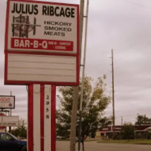 a sign for a bar - b - q