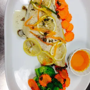 a plate of fish and vegetables
