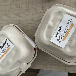 two styrofoam containers on a table