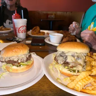 two burgers and french fries