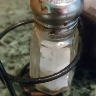 Rusty, dirty, clogged salt shaker.