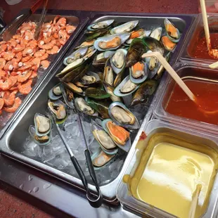 a variety of seafood and condiments