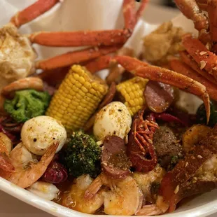Shrimp sausage crab crawfish lobster egg potato corn