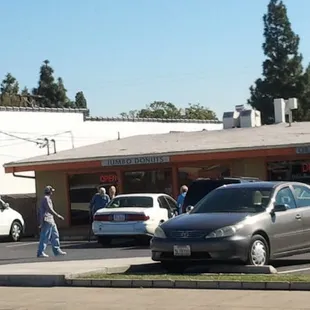 a man walking across a parking lot