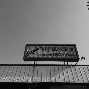 a black and white photo of a sign