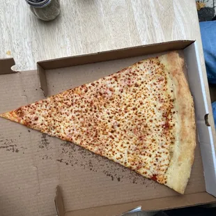 a slice of pizza in a box