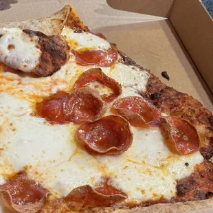 Jumbo slice pepperoni close up