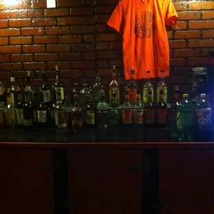 a t - shirt hanging on a brick wall