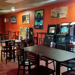 a pool table and arcade machines
