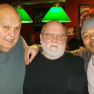 three men posing for a picture