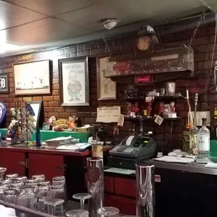 a row of liquor bottles on the bar