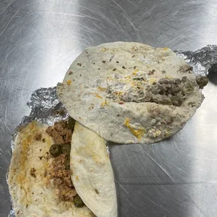 The meat doesn't even fill a quarter of the tortilla