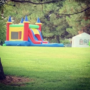 Basic Castle 5in 1 Combo. Features Bounce House, Basketball Hoop, Climbing Wall, Slide (Wet/Dry), &amp; Optional Pool.