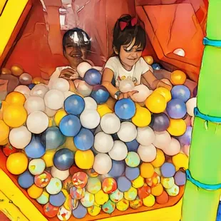 Kids enjoying in little ball pit