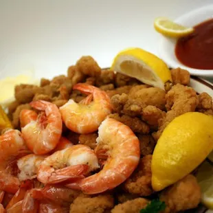 shrimp, corn, and corn on a plate
