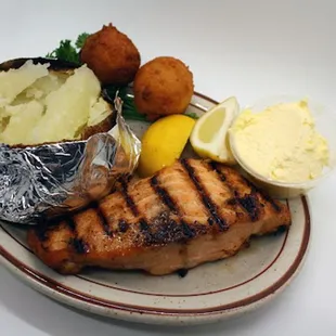 grilled fish and potatoes on a plate
