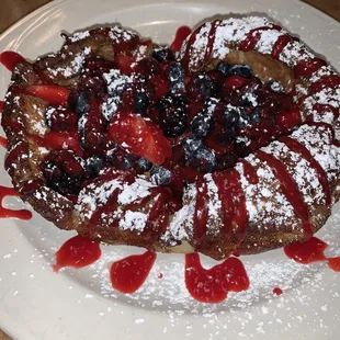 Puff pancake with strawberries, blueberries &amp; raspberries - has fought bottom and crispy edges. Excellent!