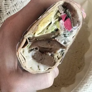 Beef/lamb gyro with pickled vegetables, tzatziki, onion, garlic sauce, cheese, lettuce.