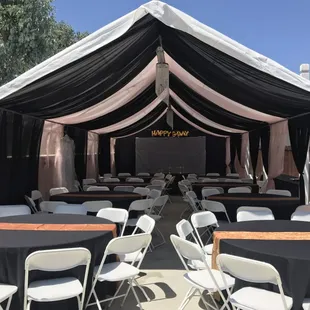 2 Tone Pink/Black Draping
W/chandeliers 
Round tables 
Black linens w/gold runners