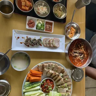 Dwaegi Bossam, Yukgaejang, ban chan and complimentary appetizer.