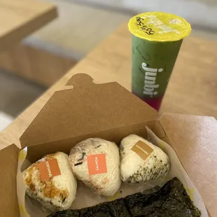 a box of donuts and a cup of yogurt