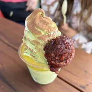 matcha vanilla swirl with red bean and mango puree and cocoa dust