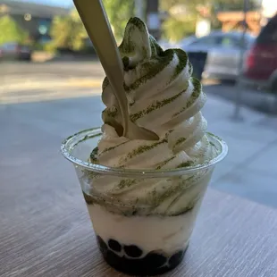 vanilla soft serve with matcha powder and boba