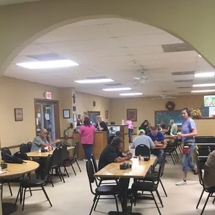 a group of people sitting at tables