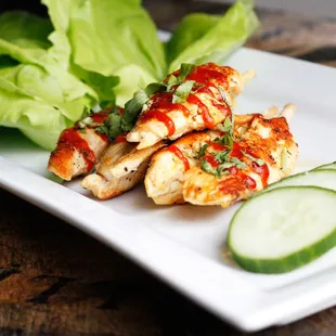 a plate of chicken and lettuce