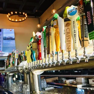 a row of beer taps
