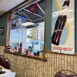 a coca cola sign in the window