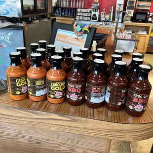 a variety of hot sauces on a table