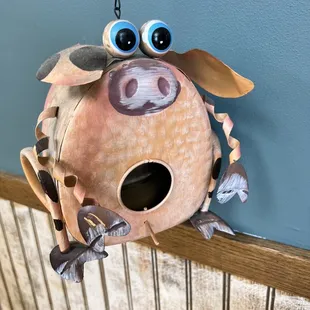 a birdhouse made to look like a pig