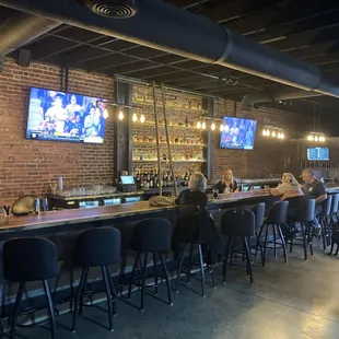 people sitting at the bar